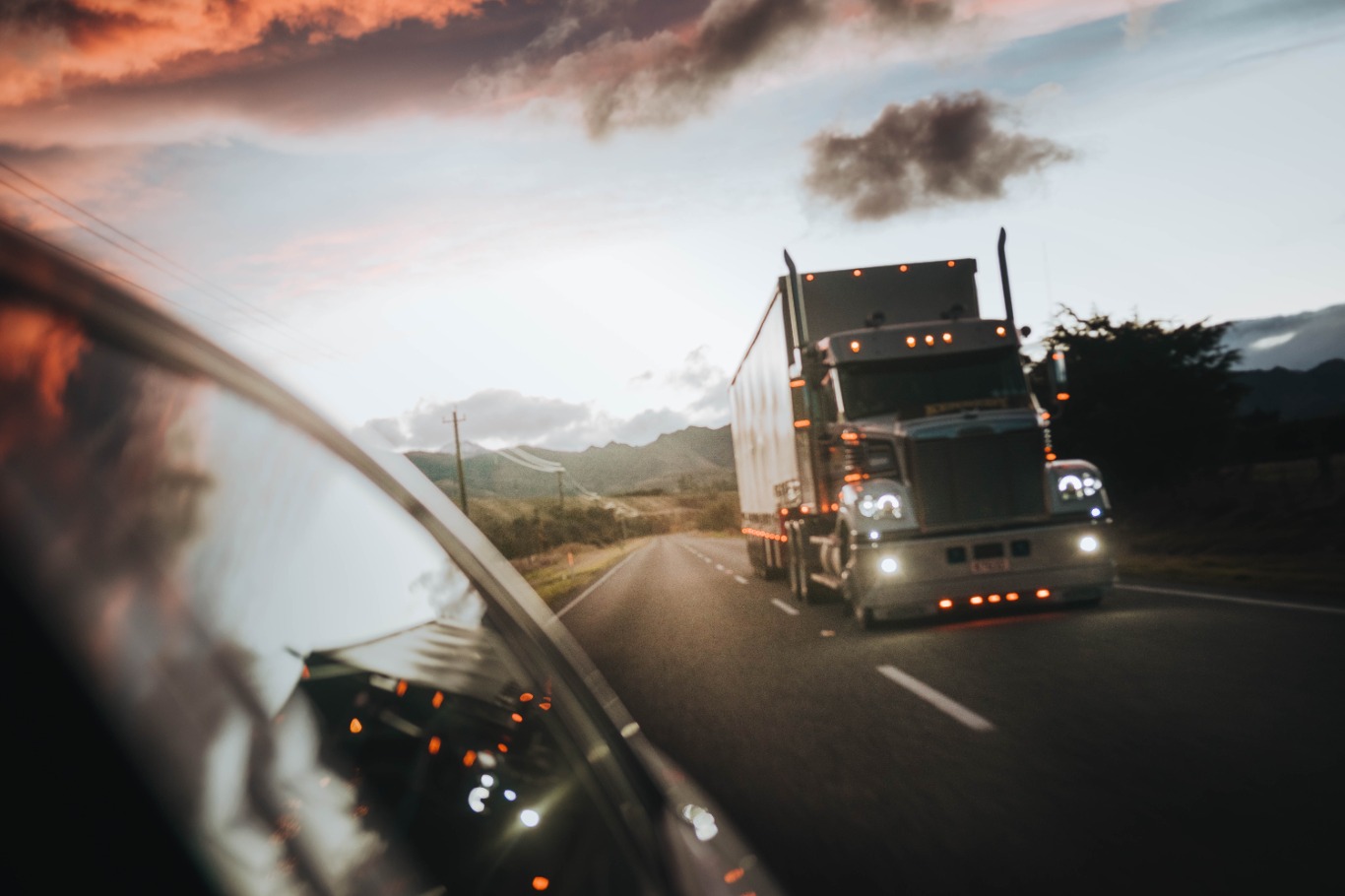 truck-on-the-road-with-lights-on